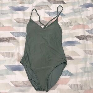 One piece v-halter-neck bathing suit with back tie